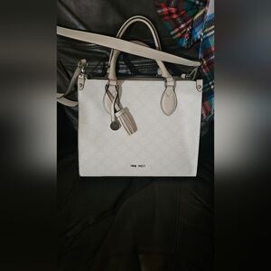 Nine West purse with strap.
